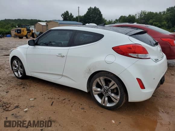 2013 Hyundai Veloster w/Black Int с VIN KMHTC6AD0DU149690, выставлен на аукционе Copart как лот 68201775 с пробегом 112 030 миль миль и Списание • Salvage title. История ставок и продаж доступна на DreamBid. Изображение 2.