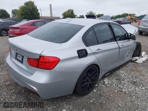 2014 BMW 3 Series 335i xDrive with VIN WBA3B9G57ENR90990, listed as a IAAI auction lot 43190976 with 94,174 mi miles and . Bid and sale history available at DreamBid. Image 4.