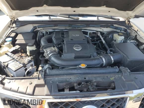 2009 Nissan Frontier SE with VIN 1N6AD07W79C403937, listed as a Copart auction lot 71112695 with 203,010 mi miles and Salvage title. Bid and sale history available at DreamBid. Image 11.