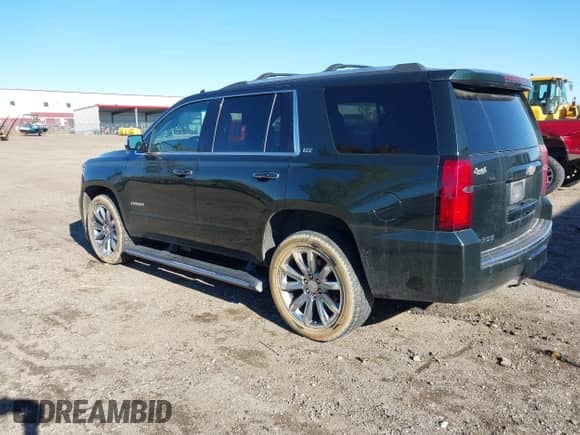 2016 Chevrolet Tahoe LTZ with VIN 1GNSKCKC7GR356857, listed as a IAAI auction lot 43515148 with 159,145 mi miles and . Bid and sale history available at DreamBid. Image 3.