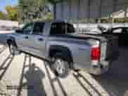 2008 Dodge Dakota Laramie with VIN 1D7HW58N28S634673, listed as a Copart auction lot 76100714 with 167,915 mi miles and Salvage title. Bid and sale history available at DreamBid. Image 2.