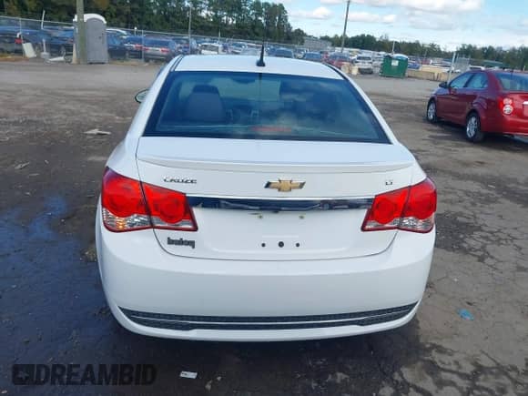 2014 Chevrolet Cruze 1LT z VIN 1G1PC5SB8E7297057, wystawiony jako IAAI lot #43383534 z przebiegiem 196 127 mil mil oraz . Historia ofert i sprzedaży dostępna na DreamBid. Obrazek 16.