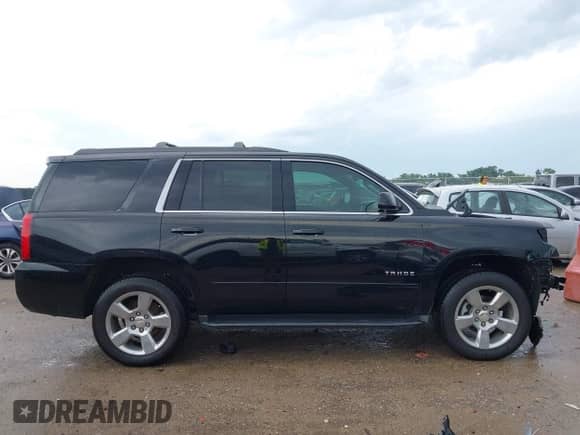 2019 Chevrolet Tahoe LS with VIN 1GNSCAKC4KR198469, listed as a IAAI auction lot 43025899 with 57,053 mi miles and . Bid and sale history available at DreamBid. Image 14.