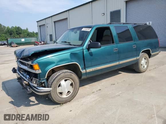 1997 Chevrolet Suburban with VIN 3GNFK16RXVG114579, listed as a Copart auction lot 57333295 with 117,040 mi miles and Salvage title. Bid and sale history available at DreamBid. Image 1.