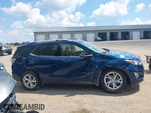 2021 Chevrolet Equinox Premier z VIN 2GNAXXEV4M6148508, wystawiony jako IAAI lot #42929506 z przebiegiem 59 861 mil mil oraz . Historia ofert i sprzedaży dostępna na DreamBid. Obrazek 13.