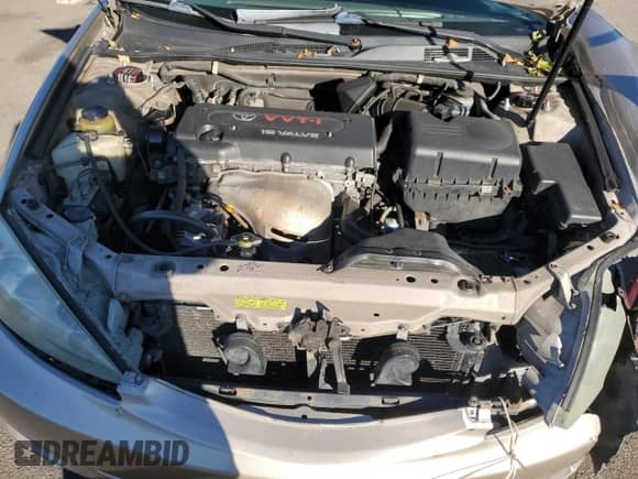 2002 Toyota Camry LE z VIN 4T1BE32K82U588621, wystawiony jako Copart lot #86985085 z przebiegiem 252 745 mil mil oraz Szkoda całkowita • Salvage title. Historia ofert i sprzedaży dostępna na DreamBid. Obrazek 11.