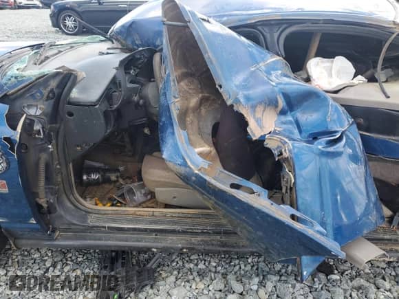 2000 Saturn SL with VIN 1G8ZG5281YZ256197, listed as a Copart auction lot 80046594 with Not provided miles and Salvage title. Bid and sale history available at DreamBid. Image 7.
