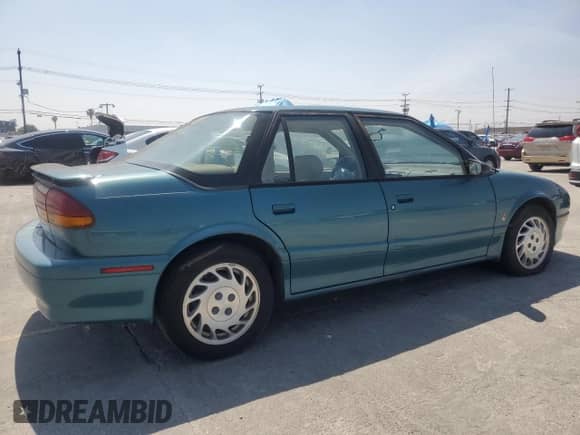 1994 Saturn SL с VIN 1G8ZK5571RZ301061, выставлен на аукционе Copart как лот 55270685 с пробегом 31 990 миль миль и Чистый • Clean title. История ставок и продаж доступна на DreamBid. Изображение 3.