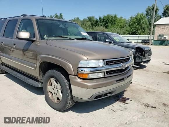 2004 Chevrolet Suburban LT z VIN 1GNFK16Z24J115142, wystawiony jako Copart lot #69387964 z przebiegiem 168 501 mil mil oraz Szkoda całkowita • Salvage title. Historia ofert i sprzedaży dostępna na DreamBid. Obrazek 11.