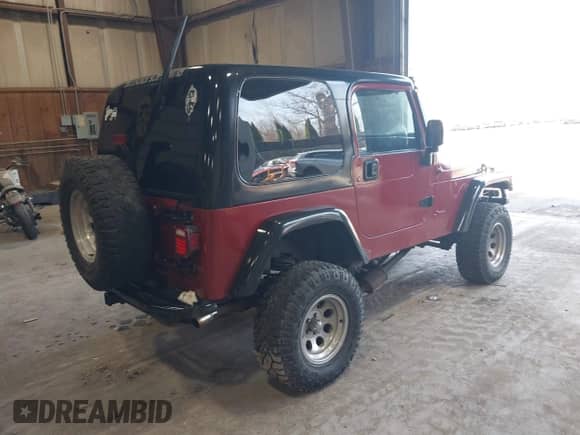 2000 Jeep Wrangler Sport z VIN 1J4FA49S9YP731865, wystawiony jako IAAI lot #43035939 z przebiegiem 221 606 mil mil oraz . Historia ofert i sprzedaży dostępna na DreamBid. Obrazek 4.
