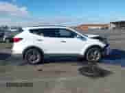 2018 Hyundai Santa Fe 2.4L z VIN 5NMZUDLB1JH067028, wystawiony jako IAAI lot #43358213 z przebiegiem 128 987 mil mil oraz . Historia ofert i sprzedaży dostępna na DreamBid. Obrazek 13.