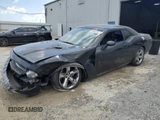 2012 Dodge Challenger SXT Plus with VIN 2C3CDYAG2CH157609, listed as a Copart auction lot 66684745 with 155,521 mi miles and Salvage title. Bid and sale history available at DreamBid. Image 1.