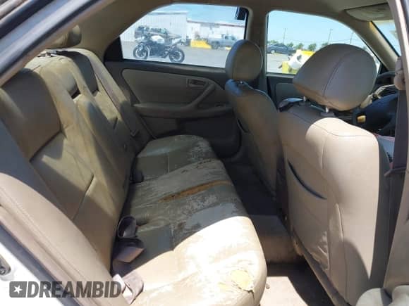 1997 Toyota Camry LE z VIN 4T1BF22K2VU921133, wystawiony jako IAAI lot #42601464 z przebiegiem 221 941 mil mil oraz . Historia ofert i sprzedaży dostępna na DreamBid. Obrazek 8.