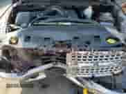 2015 Ram 1500 Laramie z VIN 1C6RR7NT1FS513691, wystawiony jako Copart lot #65722085 z przebiegiem 148 341 mil mil oraz Szkoda całkowita • Salvage title. Historia ofert i sprzedaży dostępna na DreamBid. Obrazek 11.