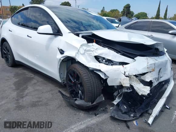 2023 Tesla Model Y Long Range with VIN 7SAYGDEE7PA124885, listed as a IAAI auction lot 43084065 with 22,983 mi miles and . Bid and sale history available at DreamBid. Image 1.