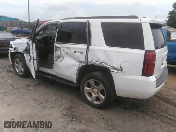 2019 Chevrolet Tahoe LT with VIN 1GNSCBKC2KR196841, listed as a IAAI auction lot 42411291 with 82,023 mi miles and . Bid and sale history available at DreamBid. Image 3.