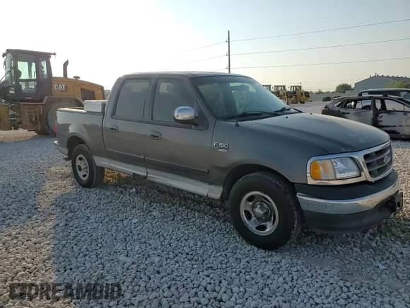 2002 Ford F-150 XLT с VIN 1FTRW07L12KC05808, выставлен на аукционе Copart как лот 80760845 с пробегом 258 794 миль миль и Списание • Salvage title. История ставок и продаж доступна на DreamBid. Изображение 13.