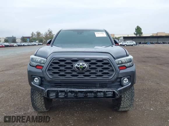 2021 Toyota Tacoma SR with VIN 3TMCZ5AN3MM450562, listed as a IAAI auction lot 43071461 with 15,850 mi miles and . Bid and sale history available at DreamBid. Image 12.