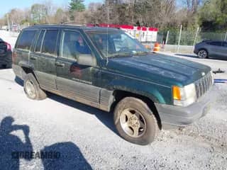 1996 Jeep Grand Cherokee with VIN 1J4EZ58Y7TC128428, listed as a IAAI auction lot 42050443 with 241,591 mi miles and . Bid and sale history available at DreamBid. Image 1.