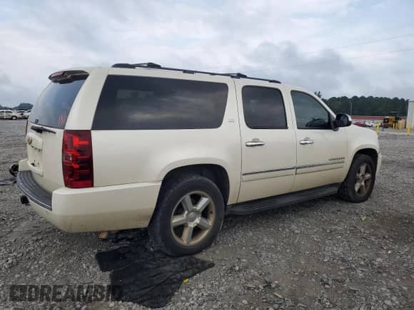 2014 Chevrolet Suburban LTZ with VIN 1GNSCKE03ER144835, listed as a Copart auction lot 69907935 with 196,941 mi miles and Salvage title. Bid and sale history available at DreamBid. Image 3.