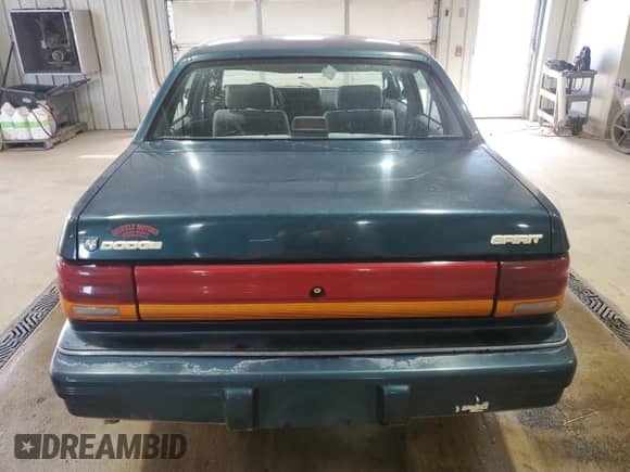 1994 Dodge Spirit with VIN 3B3AA4638RT310022, listed as a Copart auction lot 63479515 with 157,435 mi miles and Salvage title. Bid and sale history available at DreamBid. Image 6.
