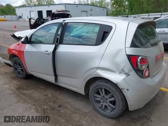 2012 Chevrolet Sonic LS with VIN 1G1JB6SH6C4153749, listed as a IAAI auction lot 42274553 with 165,248 mi miles and . Bid and sale history available at DreamBid. Image 3.