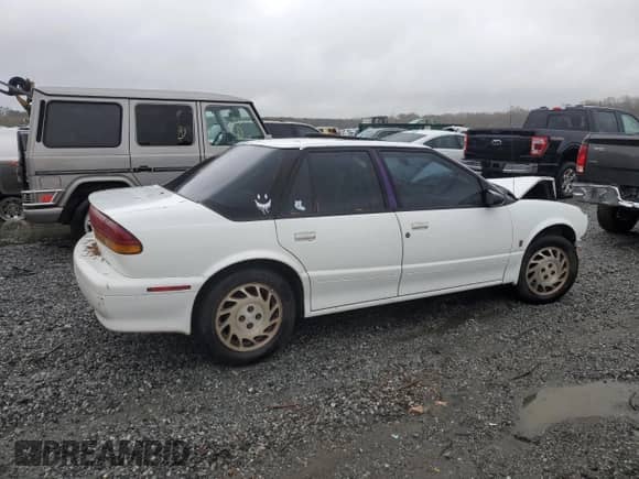 1994 Saturn SL with VIN 1G8ZJ5578RZ203874, listed as a Copart auction lot 80235024 with 232,040 mi miles and Salvage title. Bid and sale history available at DreamBid. Image 3.