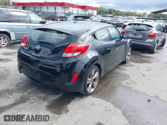 2012 Hyundai Veloster w/Gray Int z VIN KMHTC6AD6CU049429, wystawiony jako IAAI lot #43410430 z przebiegiem 153 050 mil mil oraz . Historia ofert i sprzedaży dostępna na DreamBid. Obrazek 4.