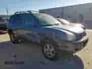 2002 Hyundai Santa Fe GLS with VIN KM8SC13D12U236331, listed as a Copart auction lot 56465815 with 161,673 mi miles and Salvage title. Bid and sale history available at DreamBid. Image 4.