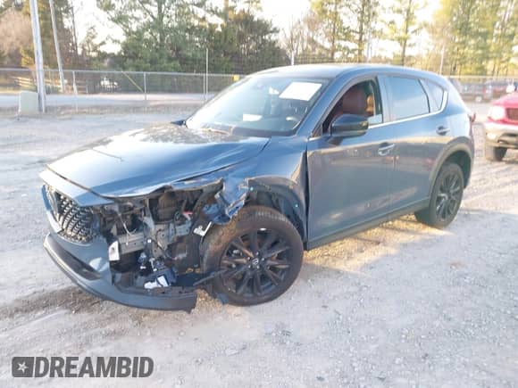 2022 Mazda CX-5 S Carbon Edition z VIN JM3KFBCM3N0537011, wystawiony jako IAAI lot #41472429 z przebiegiem 31 498 mil mil oraz . Historia ofert i sprzedaży dostępna na DreamBid. Obrazek 17.