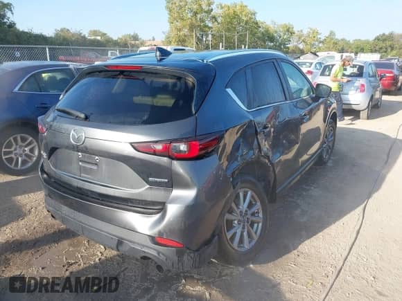 2022 Mazda CX-5 S Select with VIN JM3KFBBM4N0563747, listed as a IAAI auction lot 43231940 with 91,597 mi miles and . Bid and sale history available at DreamBid. Image 4.