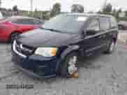 2014 Dodge Grand Caravan SE with VIN 2C4RDGBG0ER187249, listed as a IAAI auction lot 42143078 with 119,097 mi miles and . Bid and sale history available at DreamBid. Image 2.