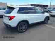 2021 Honda Passport EX-L with VIN 5FNYF7H59MB001083, listed as a IAAI auction lot 42943781 with 56,549 mi miles and . Bid and sale history available at DreamBid. Image 4.