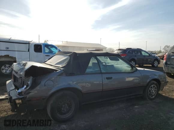 1987 Chevrolet Cavalier z VIN 1G1JE31W5H7194966, wystawiony jako Copart lot #48345315 z przebiegiem 111 052 mil mil oraz Szkoda całkowita • Salvage title. Historia ofert i sprzedaży dostępna na DreamBid. Obrazek 3.