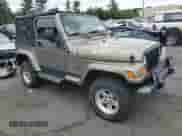 2004 Jeep Wrangler Sahara с VIN 1J4FA59S84P801582, выставлен на аукционе Copart как лот 64183535 с пробегом 127 213 миль миль и Списание • Salvage title. История ставок и продаж доступна на DreamBid. Изображение 4.