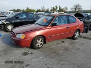 2000 Hyundai Accent with VIN KMHCG35G7YU033965, listed as a Copart auction lot 82433065 with 111,729 mi miles and Salvage title. Bid and sale history available at DreamBid. Image 1.