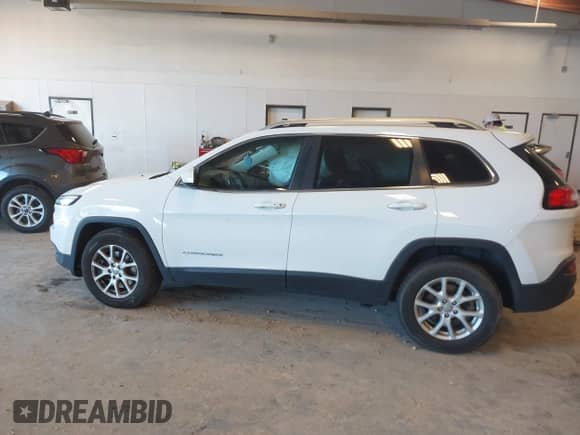 2014 Jeep Cherokee Latitude with VIN 1C4PJMCS8EW198735, listed as a IAAI auction lot 43107933 with 151,394 mi miles and . Bid and sale history available at DreamBid. Image 14.