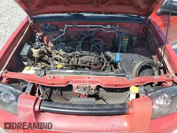 2002 Nissan Frontier XE z VIN 1N6DD26S02C324655, wystawiony jako Copart lot #65977475 z przebiegiem Nie podano mil oraz Czysty tytuł • Clean title. Historia ofert i sprzedaży dostępna na DreamBid. Obrazek 11.