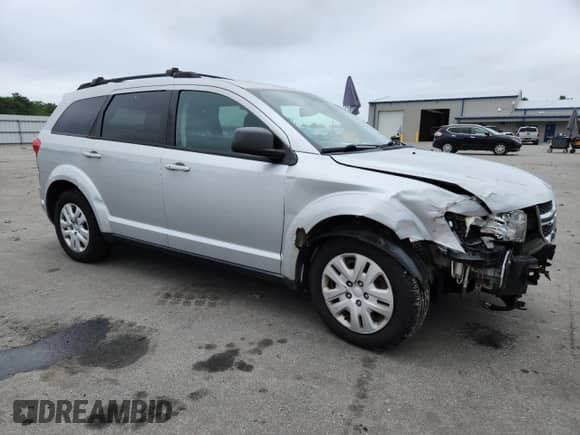 2014 Dodge Journey SE with VIN 3C4PDDAG0ET284651, listed as a Copart auction lot 64187145 with 182,485 mi miles and Salvage title. Bid and sale history available at DreamBid. Image 4.