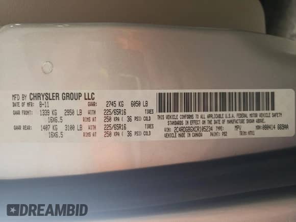 2012 Dodge Grand Caravan American Value z VIN 2C4RDGBGXCR105234, wystawiony jako Copart lot #69327725 z przebiegiem 141 911 mil mil oraz Szkoda całkowita • Salvage title. Historia ofert i sprzedaży dostępna na DreamBid. Obrazek 13.