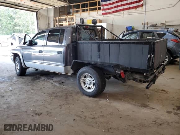 2003 Dodge Dakota SLT с VIN 1D7HG48NX3S100353, выставлен на аукционе Copart как лот 71897645 с пробегом 110 269 миль миль и На запчасти • Non repairable. История ставок и продаж доступна на DreamBid. Изображение 2.
