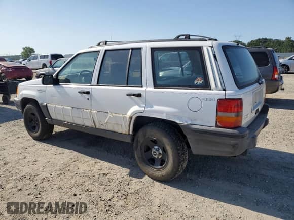 1993 Jeep Grand Cherokee Laredo with VIN 1J4GZ58Y0PC584429, listed as a Copart auction lot 58251785 with 147,913 mi miles and Salvage title. Bid and sale history available at DreamBid. Image 2.
