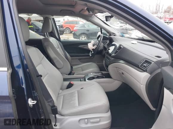 2022 Honda Pilot EX-L with VIN 5FNYF6H53NB010082, listed as a IAAI auction lot 41605798 with 52,733 mi miles and . Bid and sale history available at DreamBid. Image 5.