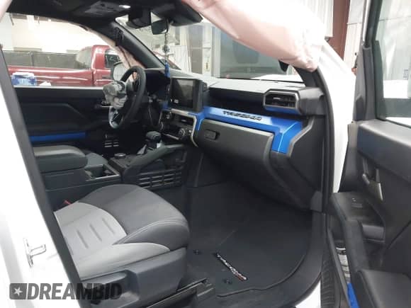 2024 Toyota Tacoma SR5 with VIN 3TMLB5FNXRM023237, listed as a IAAI auction lot 43162178 with 5,914 mi miles and . Bid and sale history available at DreamBid. Image 5.