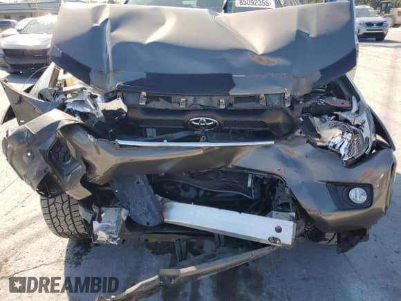 2014 Toyota Tacoma PreRunner z VIN 5TFJU4GN3EX052089, wystawiony jako Copart lot #85092355 z przebiegiem 106 271 mil mil oraz Szkoda całkowita • Salvage title. Historia ofert i sprzedaży dostępna na DreamBid. Obrazek 11.