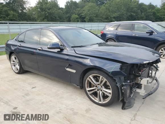 2015 BMW 7 Series 750i with VIN WBAYA8C51FG197764, listed as a Copart auction lot 67095554 with 167,458 mi miles and Salvage title. Bid and sale history available at DreamBid. Image 4.