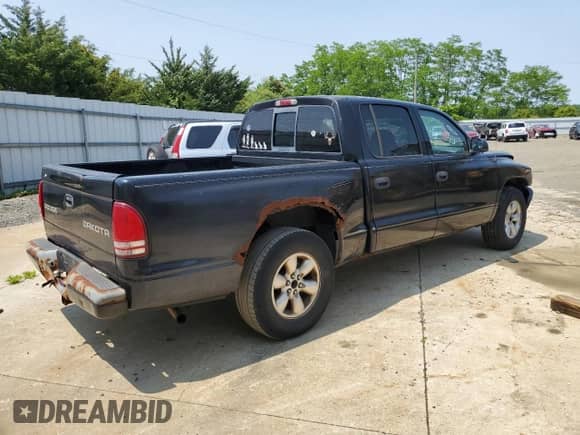 2003 Dodge Dakota Sport with VIN 1D7HL38X13S339796, listed as a Copart auction lot 59045075 with 198,091 mi miles and Salvage title. Bid and sale history available at DreamBid. Image 3.