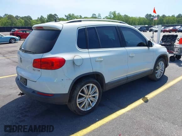 2015 Volkswagen Tiguan S with VIN WVGAV7AX4FW506314, listed as a IAAI auction lot 42063584 with 143,939 mi miles and . Bid and sale history available at DreamBid. Image 4.