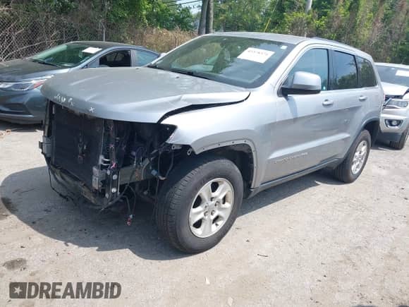 2016 Jeep Grand Cherokee Laredo with VIN 1C4RJFAGXGC338565, listed as a IAAI auction lot 42378371 with 104,037 mi miles and . Bid and sale history available at DreamBid. Image 18.