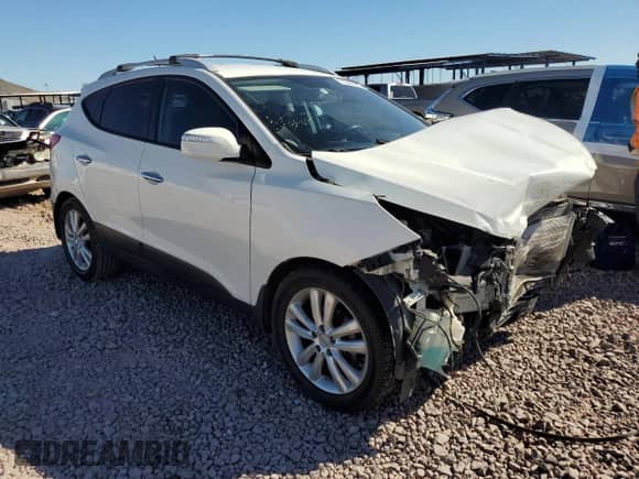 2011 Hyundai Tucson Limited with VIN KM8JU3AC7BU222304, listed as a Copart auction lot 71310104 with 118,726 mi miles and Salvage title. Bid and sale history available at DreamBid. Image 4.